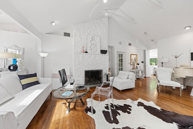 10 Twin Falls Ln, Westport, CT 06880 - living area featuring high vaulted ceiling, a fireplace, and wood finished floors