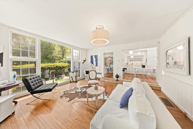 10 Twin Falls Ln, Westport, CT 06880 - living room with wood finished floors and a baseboard radiator