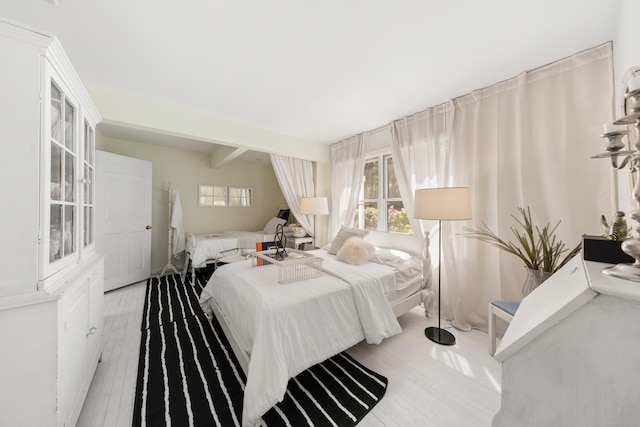 10 Twin Falls Ln, Westport, CT 06880 - bedroom featuring wood finished floors, multiple windows, and beam ceiling