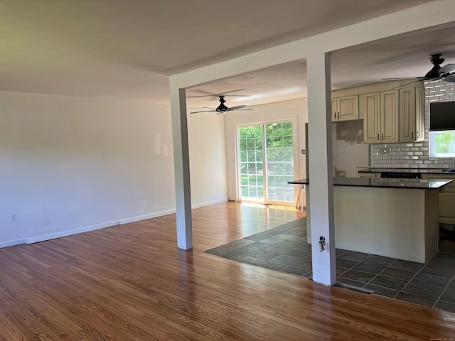 132 Walkley Dr, Southington, CT 06489 - kitchen with a ceiling fan, dark wood-style floors, dark countertops, and decorative backsplash