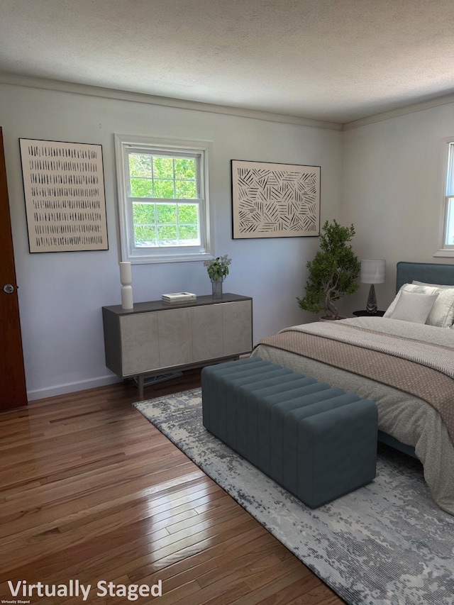 132 Walkley Dr, Southington, CT 06489 - bedroom featuring multiple windows, wood finished floors, baseboards, and a textured ceiling