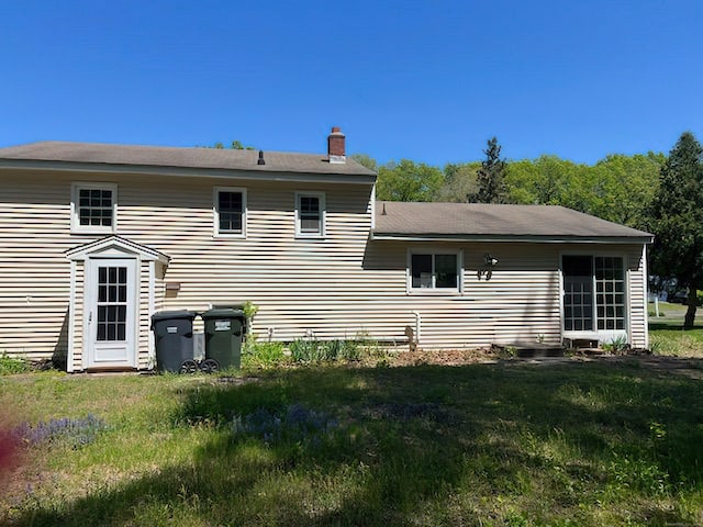 132 Walkley Dr, Southington, CT 06489 - rear view of house featuring a chimney and a yard