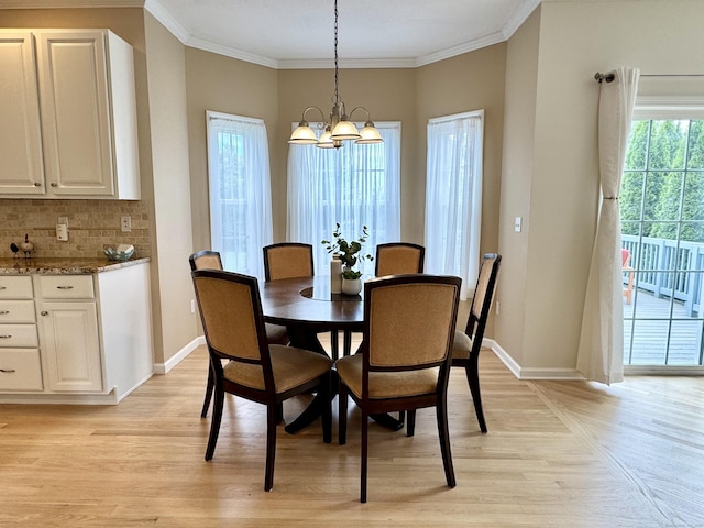 39 Farmstead Ln, Suffield, CT 06078 - dining room with light wood-style flooring, a chandelier, crown molding, and baseboards
