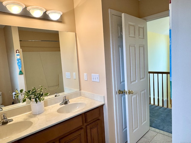39 Farmstead Ln, Suffield, CT 06078 - bathroom with toilet, double vanity, and tile patterned floors