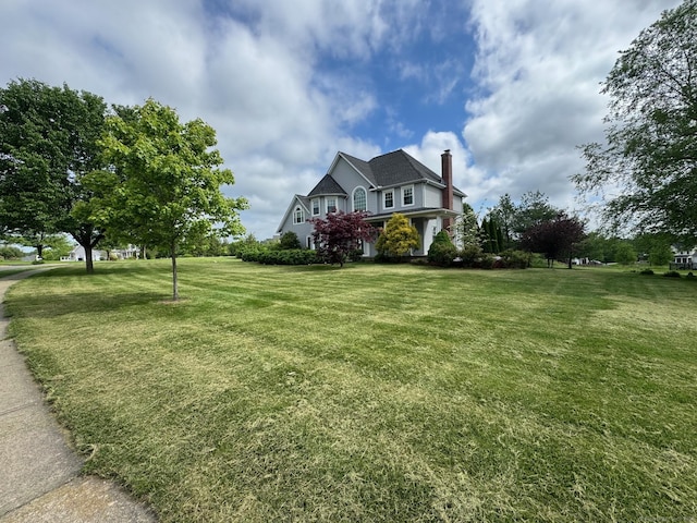 39 Farmstead Ln, Suffield, CT 06078 - view of front of property with a chimney and a front yard