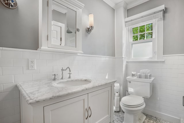 12 Woody Pl, Ridgefield, CT 06877 - bathroom with tile walls, toilet, vanity, crown molding, and a wainscoted wall
