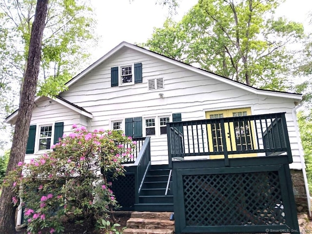12 Woody Pl, Ridgefield, CT 06877 - rear view of house featuring stairway and a wooden deck