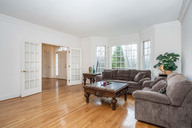 7 Brighton Ln, Simsbury, CT 06070 - living room featuring baseboards, ornamental molding, french doors, and light wood-type flooring