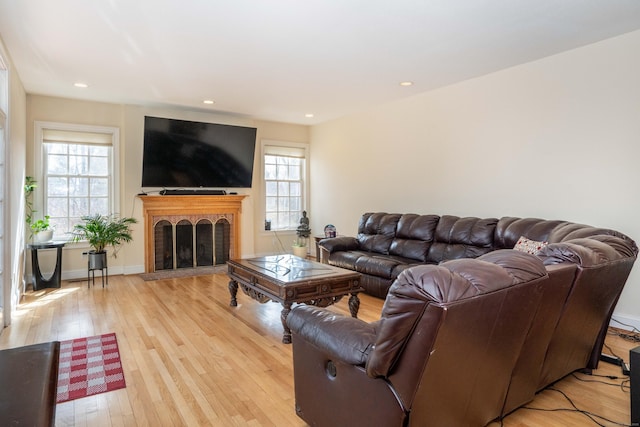 7 Brighton Ln, Simsbury, CT 06070 - living area featuring light wood finished floors, a brick fireplace, and recessed lighting