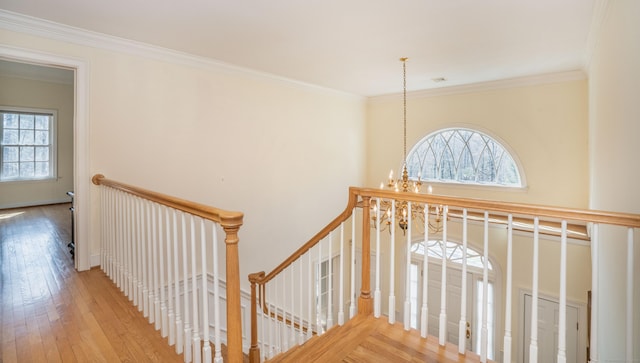 7 Brighton Ln, Simsbury, CT 06070 - stairs featuring a chandelier, crown molding, plenty of natural light, and wood finished floors