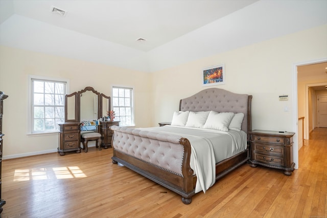 7 Brighton Ln, Simsbury, CT 06070 - bedroom with vaulted ceiling, light wood-style floors, visible vents, and baseboards