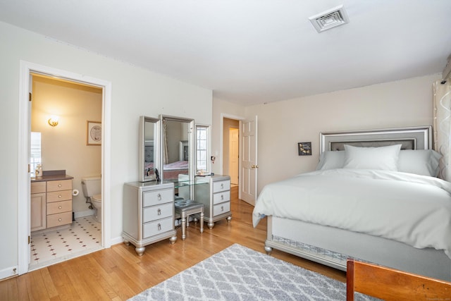 7 Brighton Ln, Simsbury, CT 06070 - bedroom featuring ensuite bathroom, baseboards, visible vents, and light wood-style floors