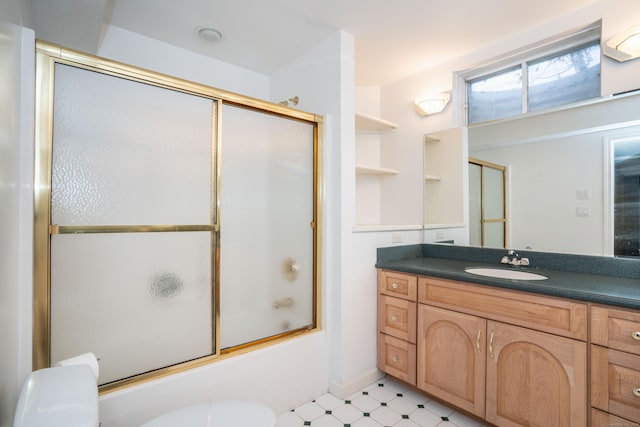 7 Brighton Ln, Simsbury, CT 06070 - bathroom with tile patterned floors, toilet, enclosed tub / shower combo, and vanity