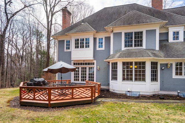 7 Brighton Ln, Simsbury, CT 06070 - rear view of house with a chimney, a yard, and a wooden deck