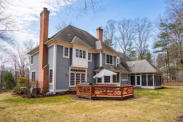 7 Brighton Ln, Simsbury, CT 06070 - rear view of property featuring a yard, a sunroom, a wooden deck, and a chimney