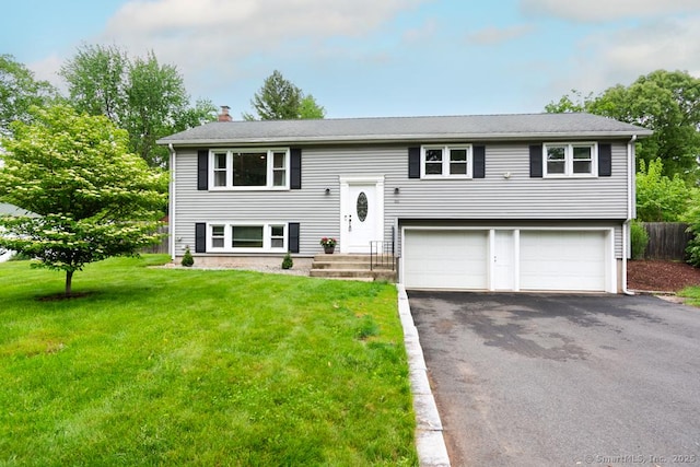 86 Rustic Ln, East Hartford, CT 06118 - raised ranch with driveway, a chimney, and an attached garage