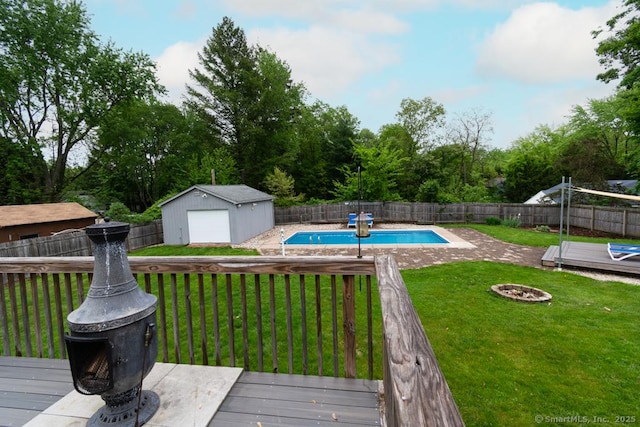 86 Rustic Ln, East Hartford, CT 06118 - view of swimming pool with a wooden deck, an outdoor fire pit, and an outbuilding