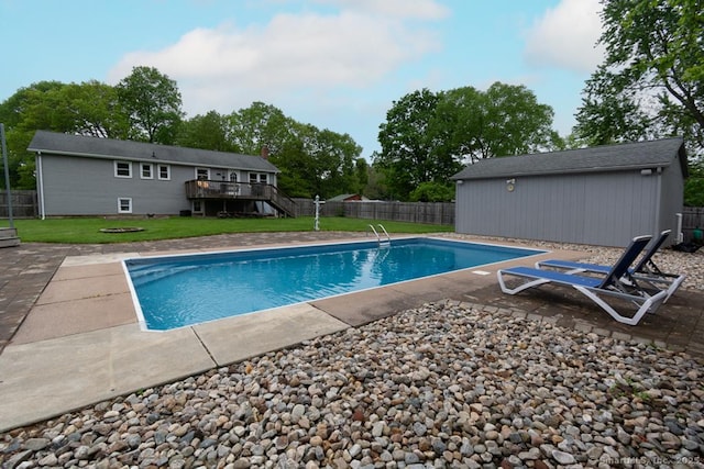 86 Rustic Ln, East Hartford, CT 06118 - view of pool with a wooden deck, a patio, and an outdoor structure