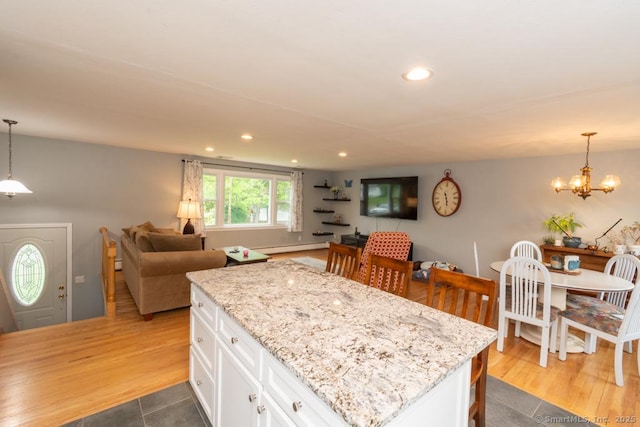 86 Rustic Ln, East Hartford, CT 06118 - kitchen featuring white cabinetry, a center island, light stone counters, recessed lighting, and open floor plan