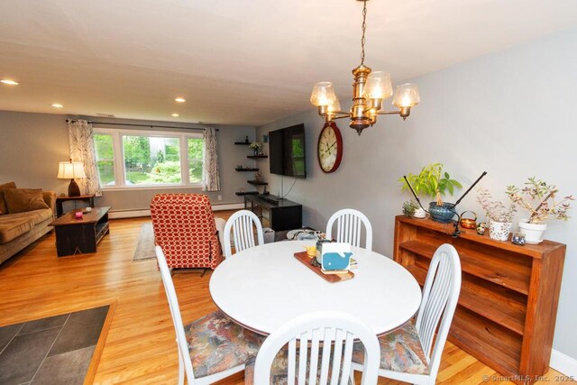 86 Rustic Ln, East Hartford, CT 06118 - dining area featuring wood finished floors, a baseboard heating unit, a chandelier, and recessed lighting