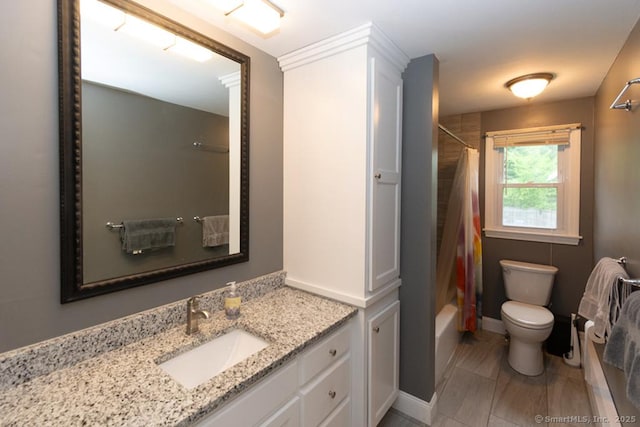 86 Rustic Ln, East Hartford, CT 06118 - full bathroom featuring toilet, vanity, shower / bathtub combination with curtain, and baseboards