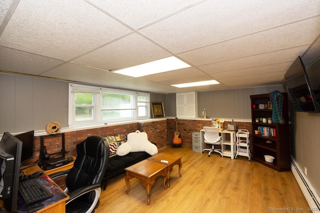 86 Rustic Ln, East Hartford, CT 06118 - office featuring a baseboard heating unit, light wood-style flooring, and a drop ceiling