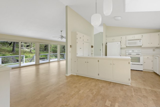 102 Colonial Rd, Guilford, CT 06437 - kitchen featuring white appliances, lofted ceiling, open floor plan, light countertops, and a peninsula