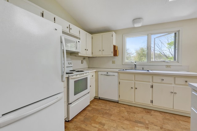 102 Colonial Rd, Guilford, CT 06437 - kitchen with white appliances, light countertops, and vaulted ceiling