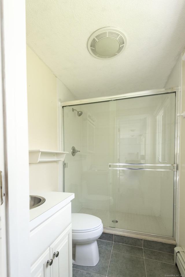 102 Colonial Rd, Guilford, CT 06437 - bathroom featuring baseboard heating, vanity, a shower stall, and tile patterned floors