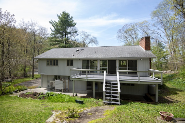 102 Colonial Rd, Guilford, CT 06437 - rear view of property featuring a chimney, stairway, roof with shingles, a patio, and a deck