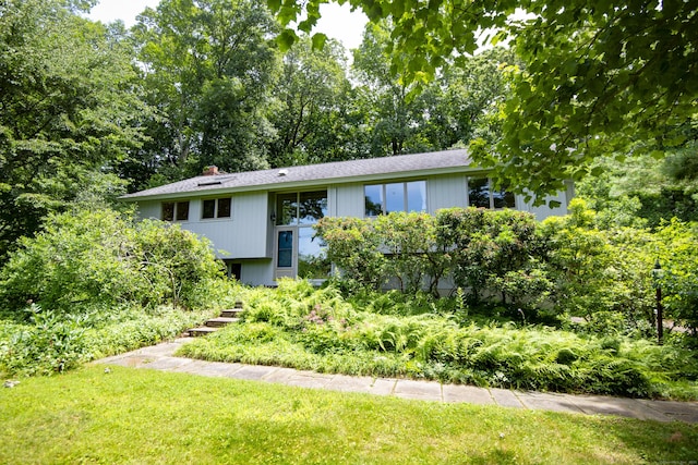 102 Colonial Rd, Guilford, CT 06437 - split foyer home featuring a front lawn and a chimney
