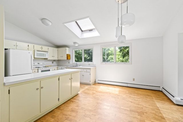 102 Colonial Rd, Guilford, CT 06437 - kitchen featuring white appliances, a skylight, light countertops, baseboard heating, and vaulted ceiling