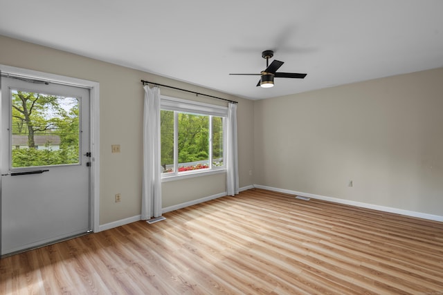 451 Cow Hill Rd, Groton, CT 06355 - spare room with healthy amount of natural light, light wood finished floors, baseboards, and a ceiling fan
