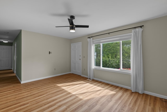 451 Cow Hill Rd, Groton, CT 06355 - unfurnished room featuring baseboards, light wood finished floors, and a ceiling fan
