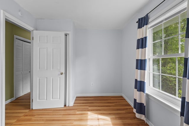 451 Cow Hill Rd, Groton, CT 06355 - unfurnished bedroom featuring light wood finished floors and baseboards