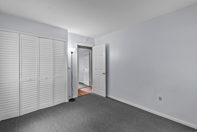 451 Cow Hill Rd, Groton, CT 06355 - unfurnished bedroom featuring carpet floors, a closet, and baseboards