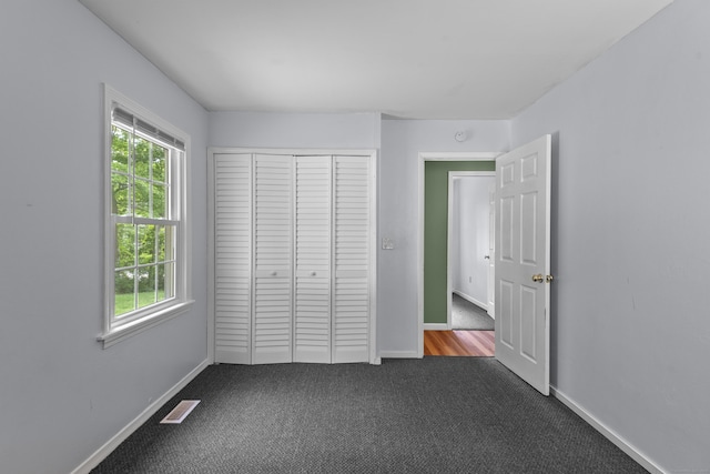 451 Cow Hill Rd, Groton, CT 06355 - unfurnished bedroom with carpet, a closet, and baseboards