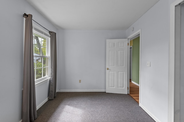 451 Cow Hill Rd, Groton, CT 06355 - unfurnished bedroom featuring carpet and baseboards