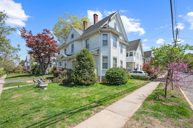 175 Lincoln St, Middletown, CT 06457 - view of side of home featuring a chimney and a lawn