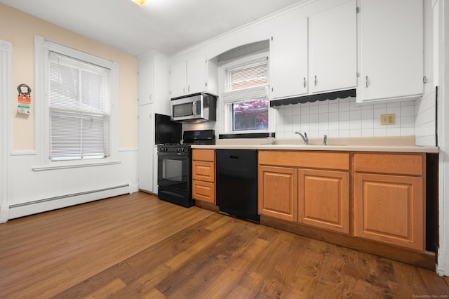 175 Lincoln St, Middletown, CT 06457 - kitchen featuring black appliances, baseboard heating, a sink, dark wood-style floors, and decorative backsplash