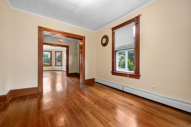 175 Lincoln St, Middletown, CT 06457 - empty room featuring a baseboard heating unit, crown molding, hardwood / wood-style floors, and baseboards