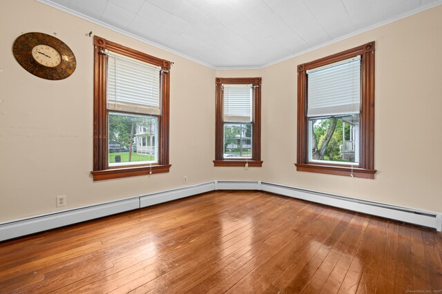 175 Lincoln St, Middletown, CT 06457 - unfurnished room with ornamental molding, hardwood / wood-style floors, and a baseboard heating unit