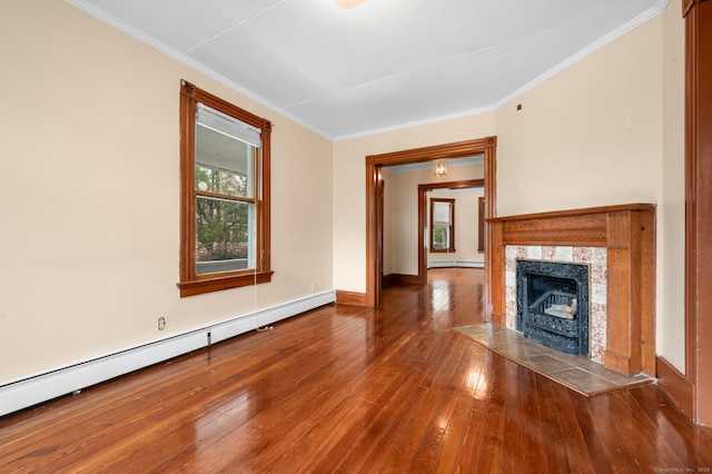 175 Lincoln St, Middletown, CT 06457 - unfurnished living room featuring a baseboard heating unit, ornamental molding, hardwood / wood-style flooring, a fireplace, and baseboards