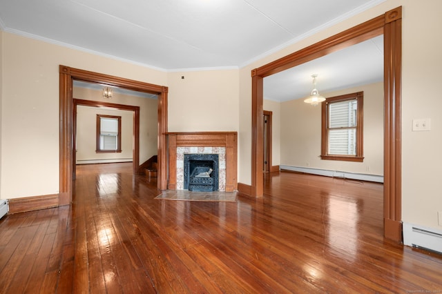 175 Lincoln St, Middletown, CT 06457 - unfurnished living room with baseboard heating, hardwood / wood-style flooring, ornamental molding, baseboards, and a premium fireplace
