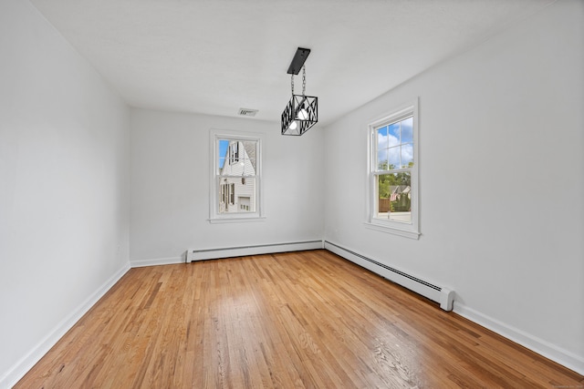 81 Summit St, Southington, CT 06489 - unfurnished room with light wood-style flooring, a baseboard radiator, and plenty of natural light