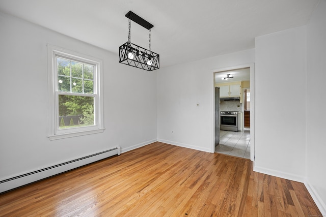 81 Summit St, Southington, CT 06489 - spare room featuring a baseboard radiator, a chandelier, wood finished floors, and baseboards