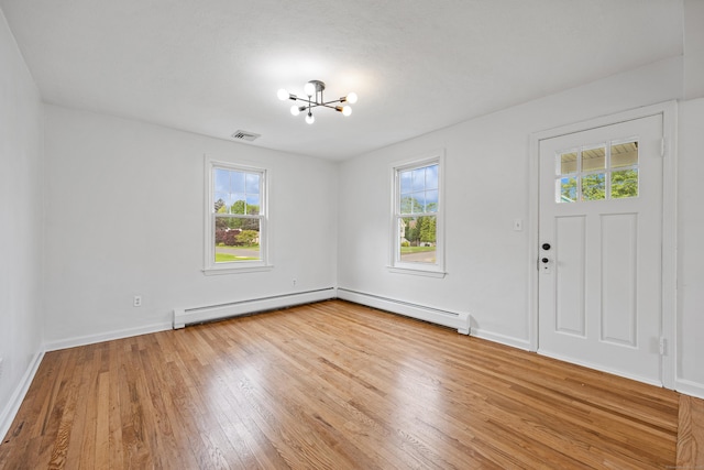 81 Summit St, Southington, CT 06489 - entrance foyer featuring healthy amount of natural light, a chandelier, hardwood / wood-style floors, and baseboards