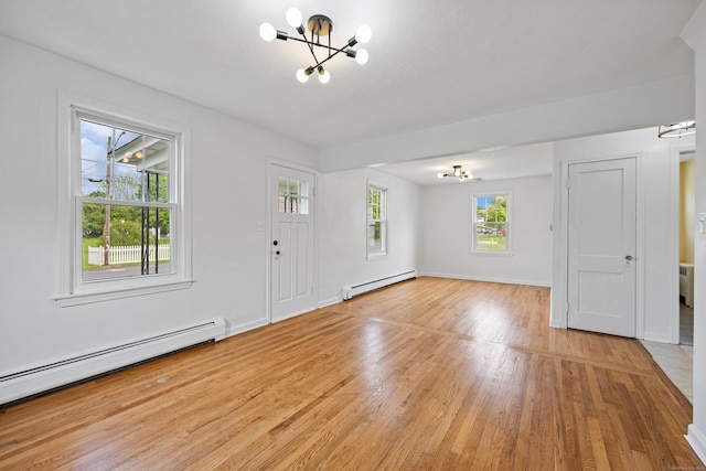 81 Summit St, Southington, CT 06489 - foyer entrance featuring a chandelier, a baseboard radiator, baseboard heating, and light wood-style flooring