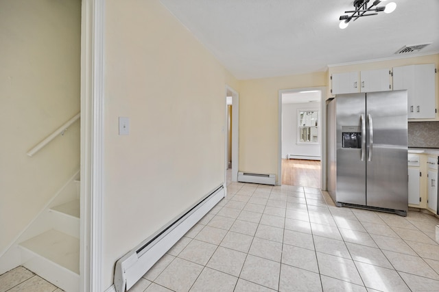 81 Summit St, Southington, CT 06489 - kitchen featuring stainless steel refrigerator with ice dispenser, a baseboard heating unit, and light tile patterned floors