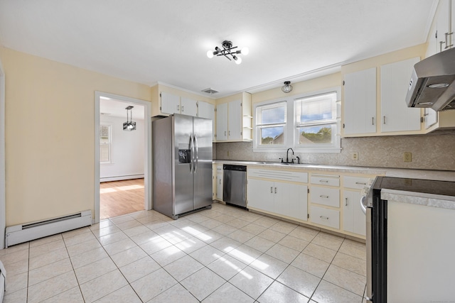 81 Summit St, Southington, CT 06489 - kitchen featuring stainless steel appliances, a baseboard radiator, backsplash, and light tile patterned flooring
